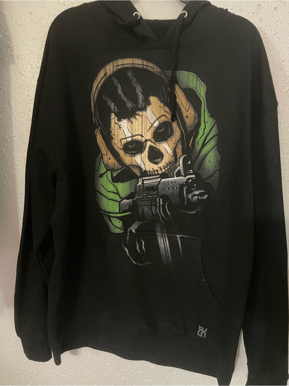 Men's Black Graphic Skull Hoodie with Green Detail